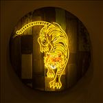 Tiger, 2016, Acrylic and neon light on wooden panel, Diameter 100 cm.
